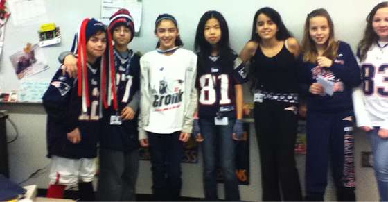 These are some of my homeroom students during Patriots Day when our states football team was in the championships Our school encouraged all the kids to dress up to show their support