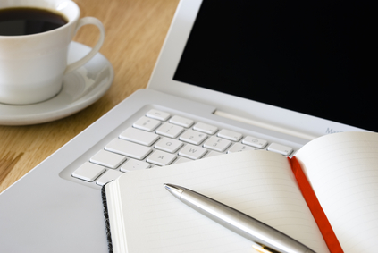 White laptop and coffee cup