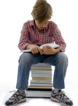 bigstock-Front-View-Of-Boy-Sitting-On-B250