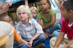 Students in class sitting on floor (selective focus)