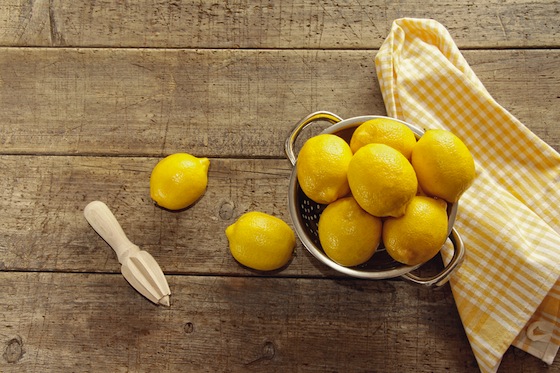 Fresh lemons on wooden counter top