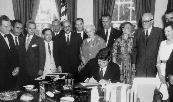 Kennedy signs the landmark 1961 Housing Act. 