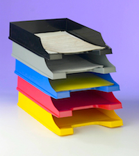 Five stackable trays with paperwork.